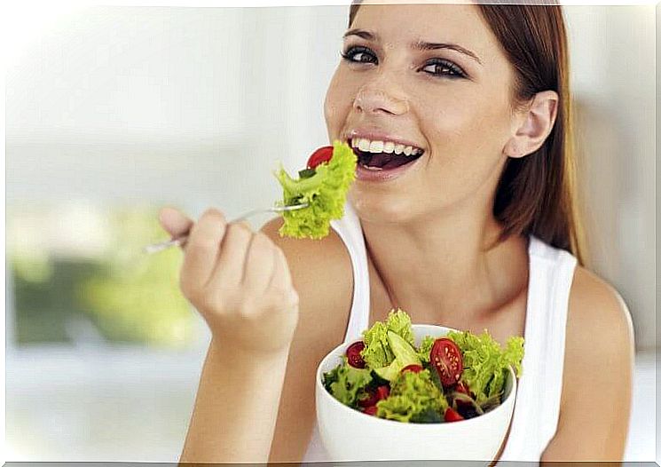 Woman eating salad