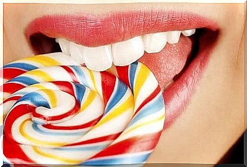 Woman eating a lollipop