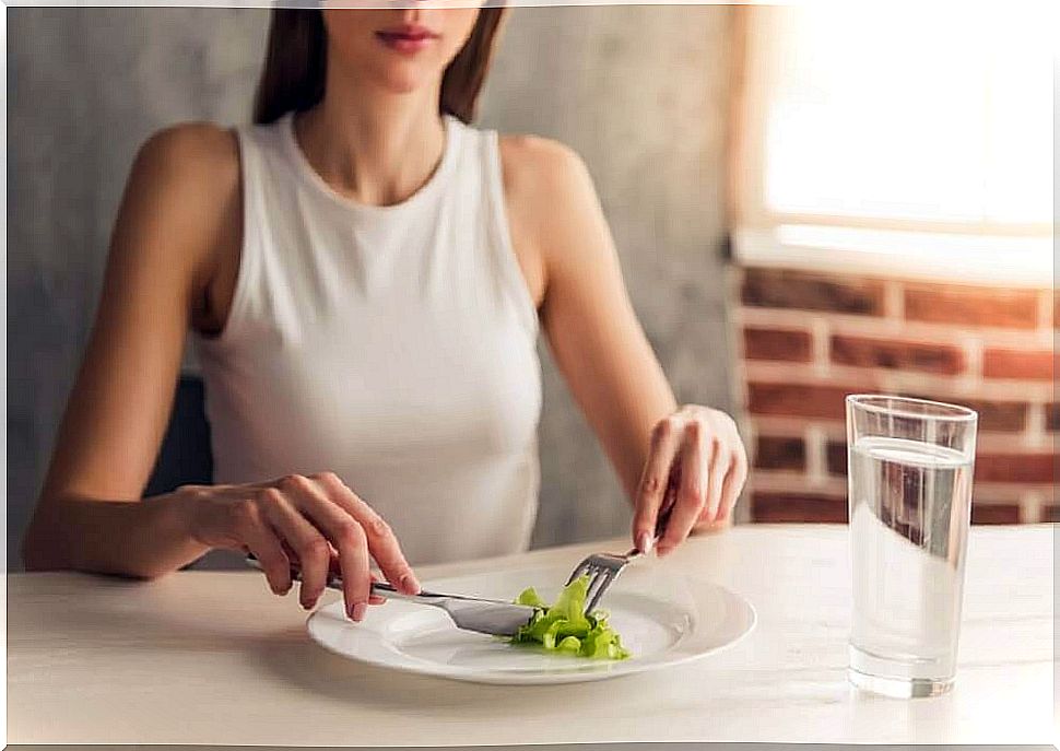 Woman eating salad