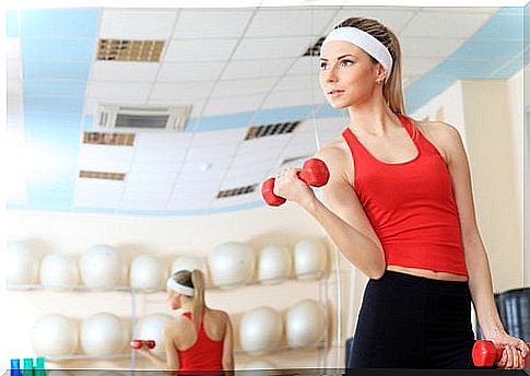 Woman exercising with dumbbells