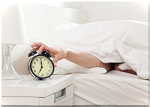 Person reaches out for wake-up call from bed