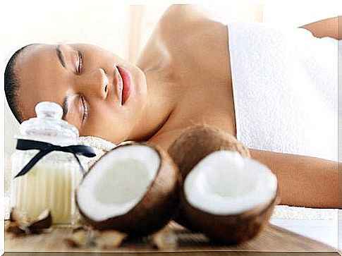 Woman lying down next to some coconut