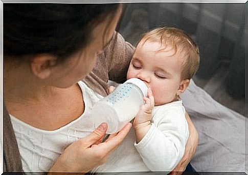 baby and feeding bottle