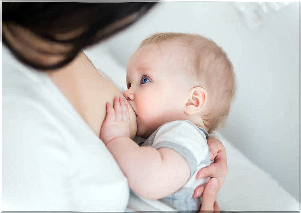 Baby drinks milk.