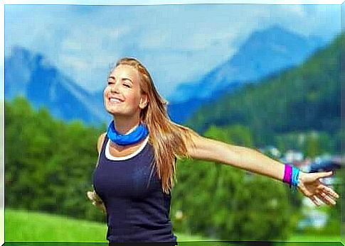 Woman smiling among mountains