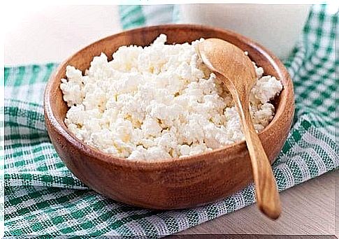 Cottage cheese in a wooden bowl