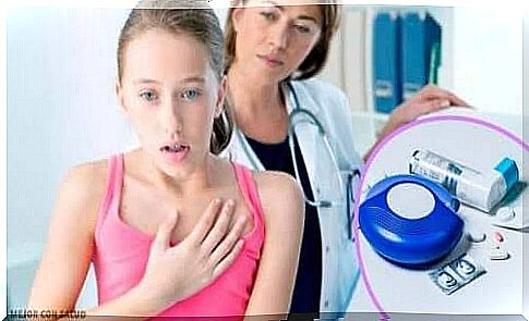 Girl with asthma is checked by a doctor