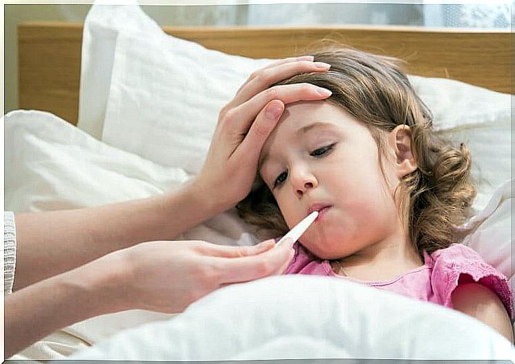 Children in bed have the temperature taken, dry cough in children