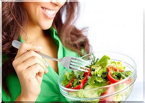 Woman eating salad