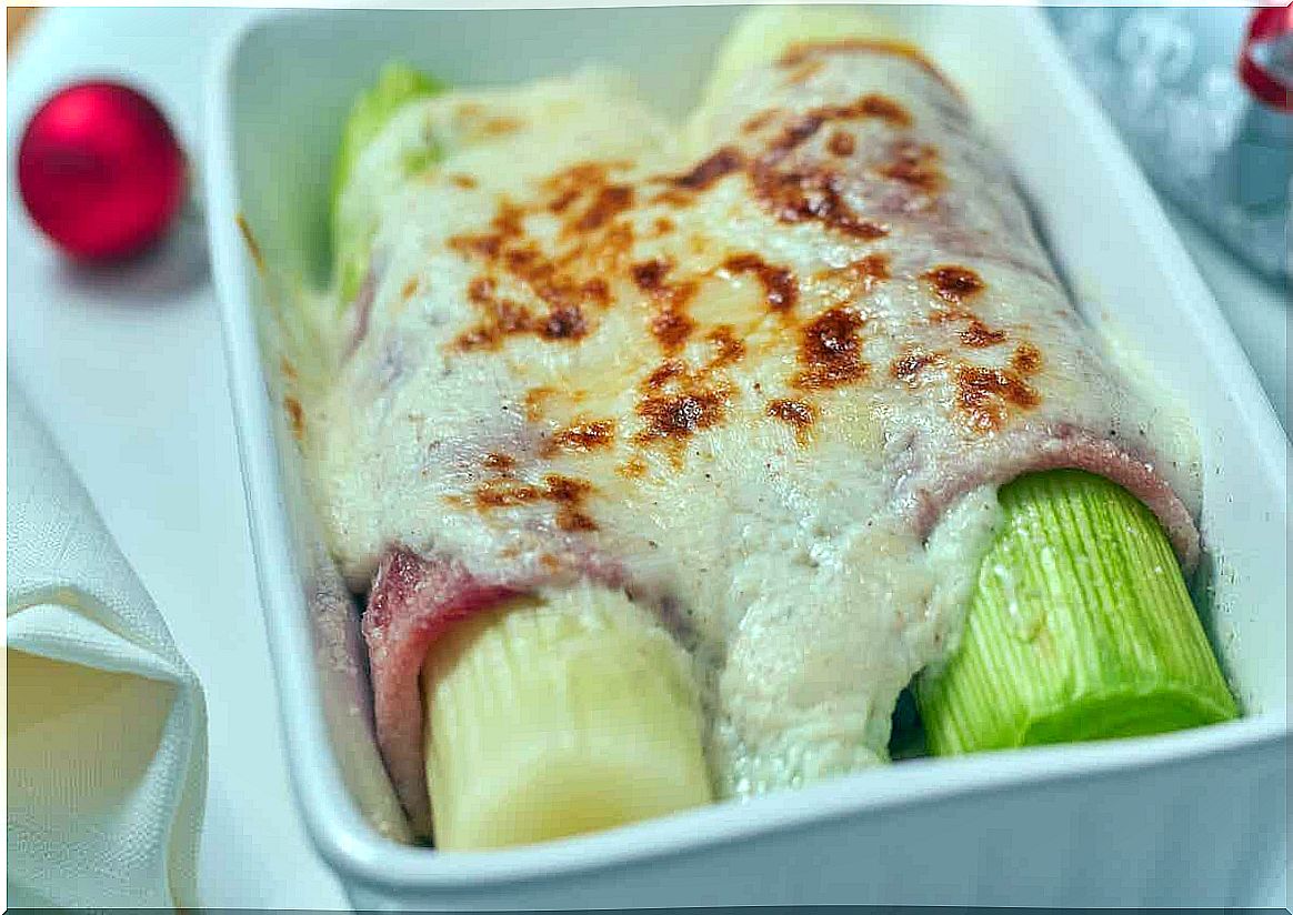 A dish of stuffed leeks with cheese and ham