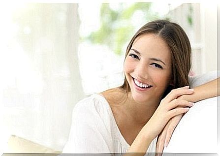 Smiling woman on sofa