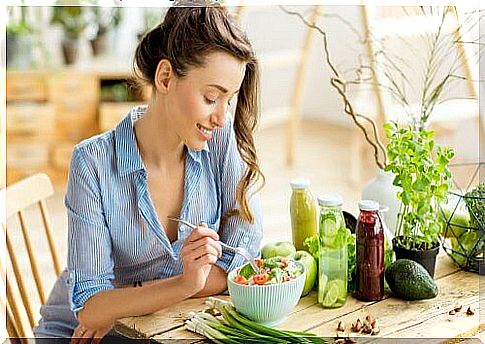 Woman eating mixed salad