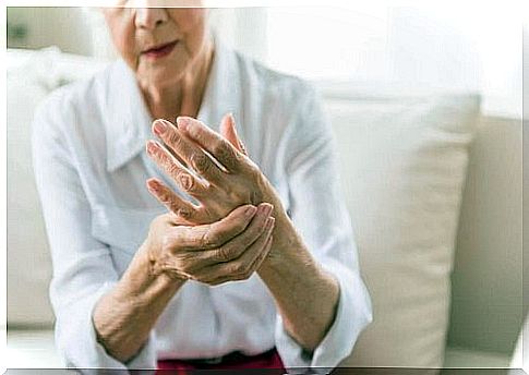 older woman massaging her palm