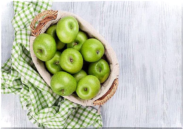 Basket of green apples - fruits to detox your body