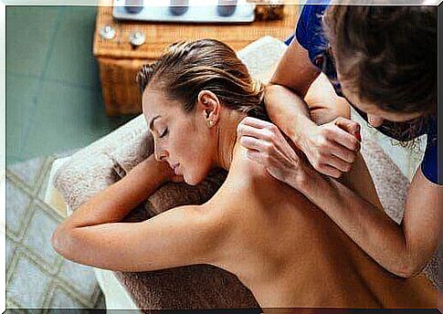 Women give woman therapeutic massage