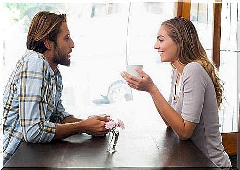 A man and woman drinking coffee together