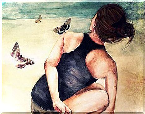 Woman sitting with butterflies